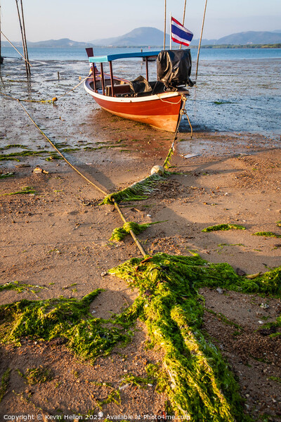 Thai long tail boat moored on sand Picture Board by Kevin Hellon