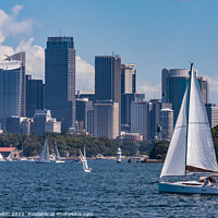 Buy canvas prints of Yachts sailing in Sydney harbour witheCentral Business District, by Kevin Hellon