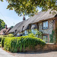 Buy canvas prints of Traditional English thatched cottages  by Kevin Hellon