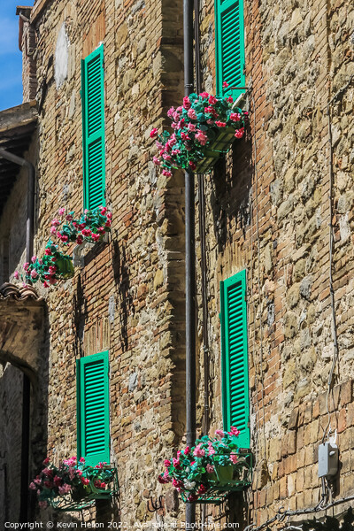 Colourful shutters on a house in Bevagna, Umbria, Italy Picture Board by Kevin Hellon