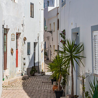 Buy canvas prints of Old Street, Albufeira, by Kevin Hellon