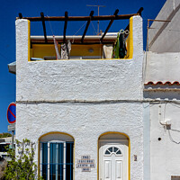 Buy canvas prints of Pretty seafront cottage, Albufeira old town,  by Kevin Hellon
