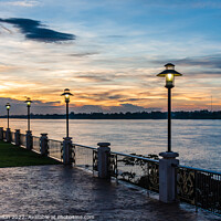 Buy canvas prints of Sunset on the Mekhong river on the promenade in Nong Khai, Thail by Kevin Hellon