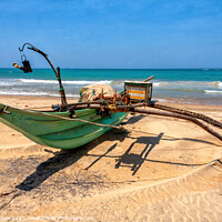 Buy canvas prints of Traditional, Sri Lankan fishing boat, beach, Colombo, Sri Lanka by Kevin Hellon