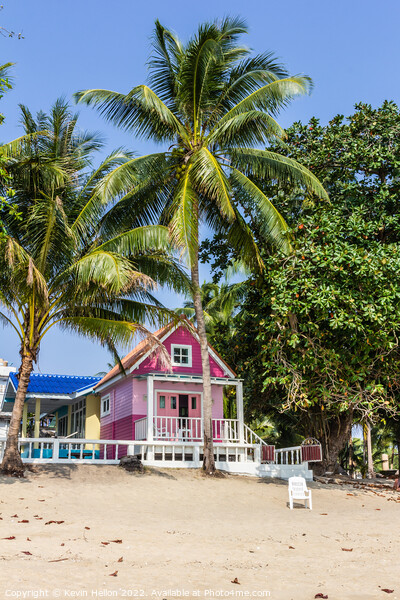 Pink Bungalow on the beach Picture Board by Kevin Hellon