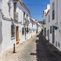 Buy canvas prints of Typical street in Mijas, by Kevin Hellon