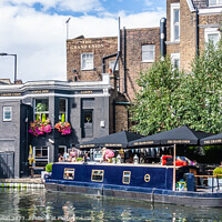 Buy canvas prints of Narrowboat morred at the Grand Union pub  by Kevin Hellon