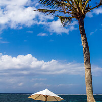 Buy canvas prints of Beach umbrella and chairs, Sanur Beach by Kevin Hellon