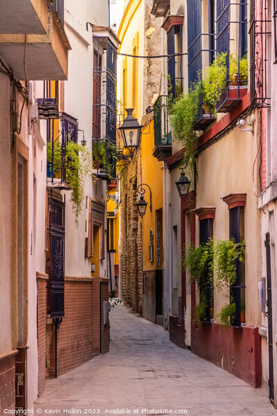 Narrow street in Seville, Spain Picture Board by Kevin Hellon