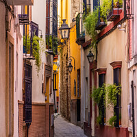 Buy canvas prints of Narrow street in Seville, Spain by Kevin Hellon