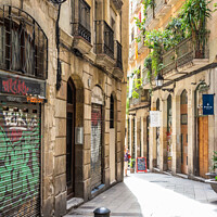 Buy canvas prints of Typical narrow street in the Gothic quarter of Barcelona, Spain by Kevin Hellon