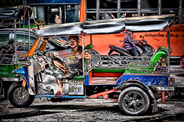 Tuk tuk driver reading the newspaper Picture Board by Kevin Hellon