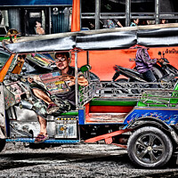 Buy canvas prints of Tuk tuk driver reading the newspaper by Kevin Hellon