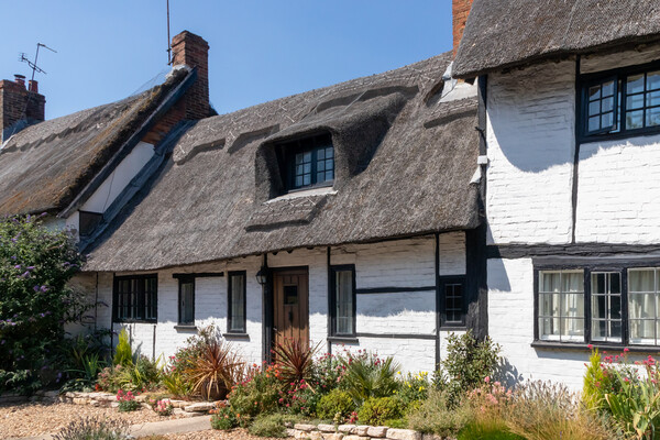 Thatched cottages in Wendover Picture Board by Kevin Hellon