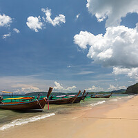 Buy canvas prints of Long tail boat moored at Ao Nang Beach by Kevin Hellon
