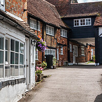 Buy canvas prints of Entrance to mews cottages in  Old Amersham by Kevin Hellon