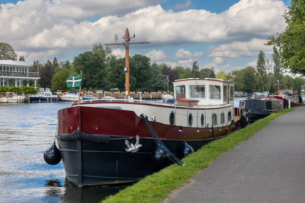 Barge moored on the River Thames in Henley  Picture Board by Kevin Hellon