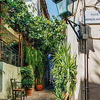 Buy canvas prints of Typical street in the Plaka District by Kevin Hellon