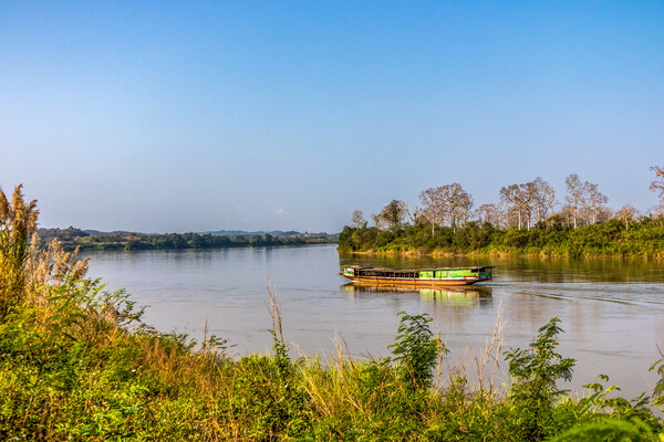 Wooden Boat on Mekong River Picture Board by Kevin Hellon