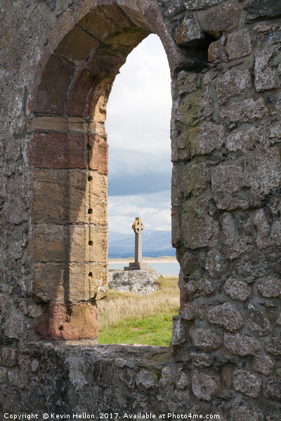 Celtic cross and remains of St Dynwen's church, Ll Picture Board by Kevin Hellon