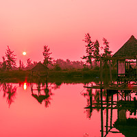 Buy canvas prints of Sunrise over the Hoi An River by Kevin Hellon