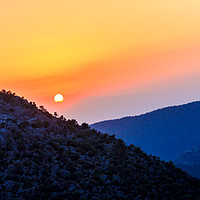 Buy canvas prints of Sunset over the mountains  by Kevin Hellon
