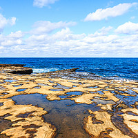 Buy canvas prints of Looking out to sea over the rock pools by Kevin Hellon