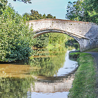 Buy canvas prints of Bridge with reflection over the Shropshire Union c by Kevin Hellon