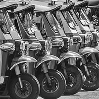 Buy canvas prints of Tuk-tuks lined up in a row, by Kevin Hellon