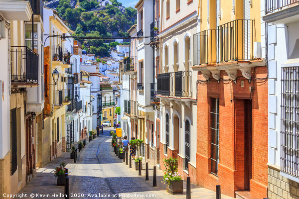 Narrow street in Ubrique, Spain Picture Board by Kevin Hellon