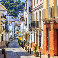 Buy canvas prints of Narrow street in Ubrique, Spain by Kevin Hellon