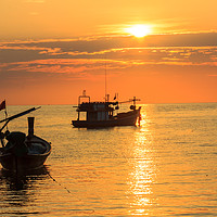 Buy canvas prints of Silhouettes of boats on Bang Tao Beach by Kevin Hellon
