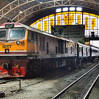 Buy canvas prints of Diesel locomotive with carriages in Hua Lampong  by Kevin Hellon