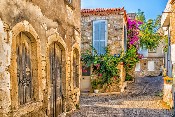 Cobbled street in Alacati Picture Board by Kevin Hellon
