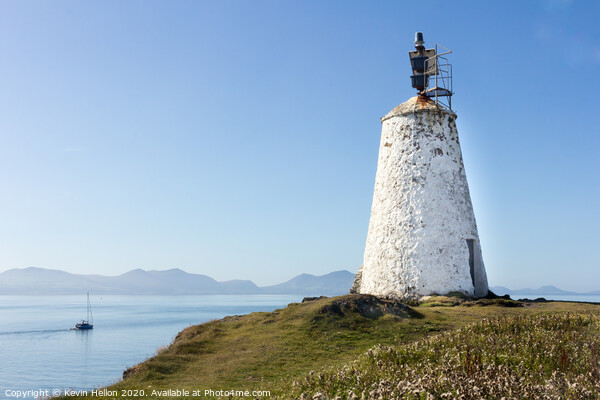 Old lighthouse on Llanddwyn Island Picture Board by Kevin Hellon