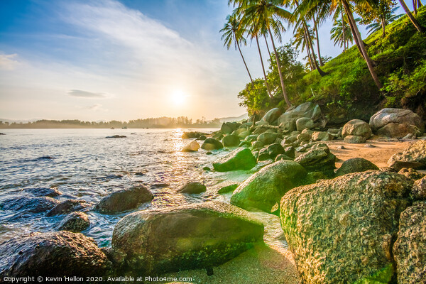 Tropical sunrise over rocks Picture Board by Kevin Hellon