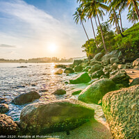 Buy canvas prints of Tropical sunrise over rocks by Kevin Hellon