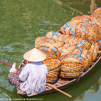 Buy canvas prints of Boat loaded with baskets by Kevin Hellon