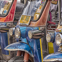 Buy canvas prints of Tuk tuks lined up in Bangkok  by Kevin Hellon