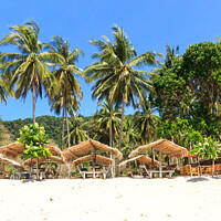 Buy canvas prints of Straw huts on Bamboo Beach by Kevin Hellon