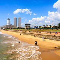 Buy canvas prints of People walking on Galle Face beach by Kevin Hellon