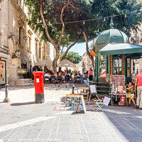 Buy canvas prints of Square with cafe and kiosk.  by Kevin Hellon