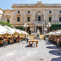 Buy canvas prints of Cafes full of tourists on Republic Street.  by Kevin Hellon