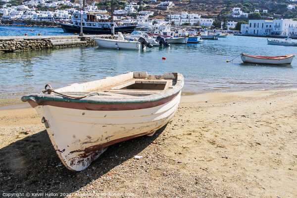 Small boat beached on sand  Picture Board by Kevin Hellon