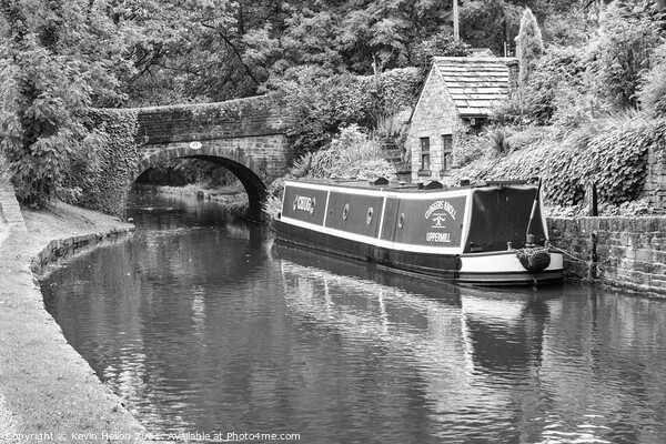 Barge moored next to a bridge Picture Board by Kevin Hellon