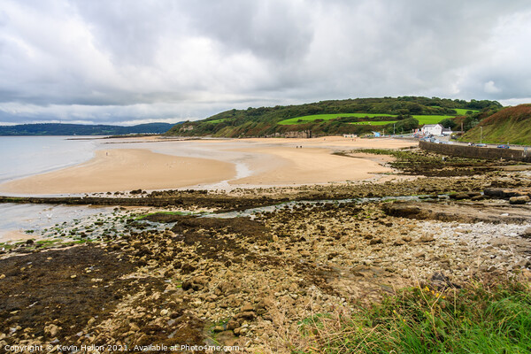 Benllech beach on a cloudy day Picture Board by Kevin Hellon
