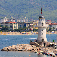 Buy canvas prints of The lighthouse guarding the entrance to Alanya harbour by Kevin Hellon