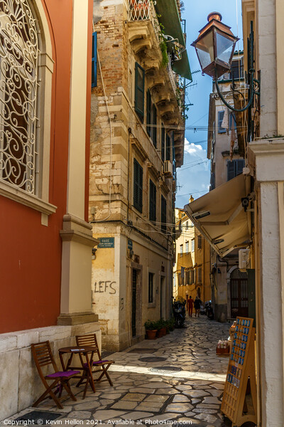Narrow street in Corfu Town Picture Board by Kevin Hellon