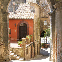 Buy canvas prints of Narrow street in Narni by Kevin Hellon
