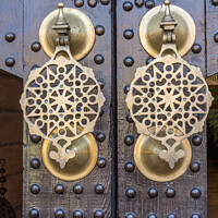 Buy canvas prints of Ornate brass doorknockers by Kevin Hellon